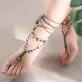 dark blue ceramic bead ankle lace, pastel-toned ceramic beads, wrapped from ankle to foot, standout fashion accessory