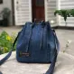 dark blue drawstring denim bucket bag from old jeans, youthful design, dynamic and stylish, compact yet spacious