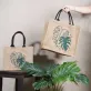 túi vải bố họa tiết lá, hoạ tiết nhiệt đới, chất liệu vải bố mộc mạc, khoang túi rộng rãi, dễ bảo quản, quai túi da chắc chắn