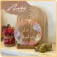 two flowers, round dried flower frame, conveying messages of love, decorative accessories, handcrafted product, meaningful gift