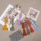 iris macrame keychain, charming handmade keychain, woven fiber material, sturdy and unique handmade accessory