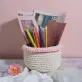 white with light pink border crochet cotton basket, sturdy, durable basket, home decor accessory, storing study supplies, a plant pot cover