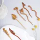 animal-shaped wooden hair pins, diverse designs, natural wood colors and grain, unique hair accessories, made from natural materials
