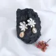 “nguyên ngọc” silver earrings with freshwater pearl, intricate floral design, exquisite craftsmanship, elegant style
