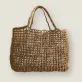 The Raffia Versa Basket Nat Tote Bag in natural brown, is the ultimate sustainable fashion handbag, perfect as a beach bag, a thoughtful gift for her, or a unique birthday gift.