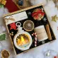 The "Light Up The Night" Christmas Gift Box is the perfect way to warm up the holiday season, featuring a gift set with a scented candle, lamp, and chocolate ornament, making it an ideal corporate gift set to spread festive cheer