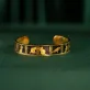 The "Cat & Box" Metal Cuff Bracelet With Hand-Painted Leather is a handmade fashion accessory that beautifully highlights individuality, making it a perfect birthday gift for her.