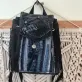 Layered mini backpack crafted from old jeans ignites your personal style through upcycled fabric design, combining rugged fashion aesthetic with environmental consciousness as unique recycled accessory and creative birthday gift