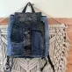 Flap mini backpack crafted from old jeans offers exclusive one-off design just for you, combining upcycled fashion sensibility with distinctive denim style as creative birthday gift and meaningful eco-friendly present.