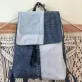 Blue mix backpack from old jeans conquering minimalist enthusiasts, an upcycled fashion accessory and unique birthday gift for sustainable style lovers.