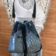 Blue printed letter bucket bag from old jeans with passion infused in every detail, creating an upcycled convenient drawstring bag and impressive birthday gift