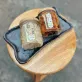 Hộp quà thốt nốt dẻo và gừng mật ong giữ vẹn nguyên vị ngon đặc sản nguyên bản, được đóng gói trong hộp quà phong cách vintage tinh tế, là món quà tặng đặc sản đậm chất Việt Nam và set quà ăn vặt lành mạnh bổ dưỡng