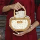 Mini Petal Woven rattan handbag compact embracing pure essence, handcrafted compact handbag sustainable fashion as Vietnamese souvenirs