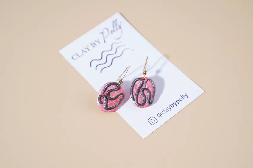 Small Oval Earrings In Color Metallic Pink & Black, Slightly Contemporary Design, Unique And Eye-Catching Fashion Accessory