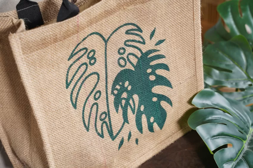 Leaf Jute Bag, Tropical Print, Rustic Canvas Material, Spacious Compartment, Easy to Maintain, Sturdy Leather Straps.