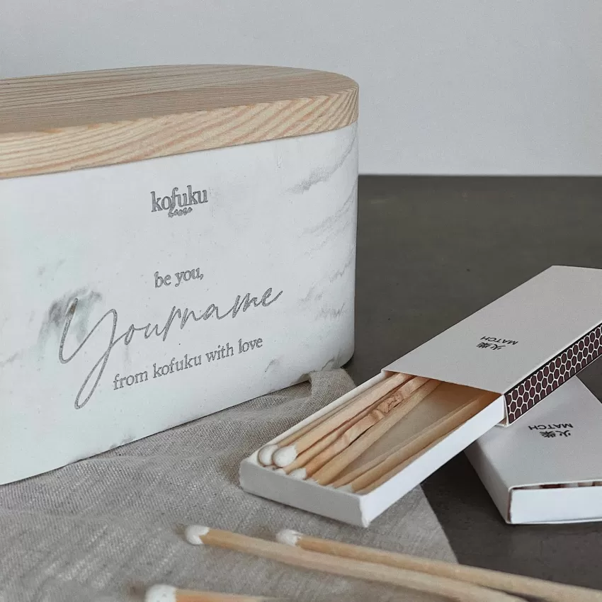 Scented candle jars with engraved names make the gift more special and personalized
