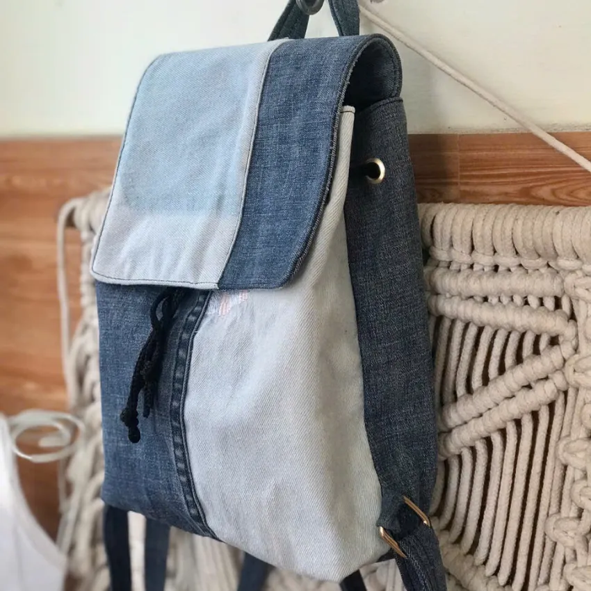 Blue mix backpack from old jeans conquering minimalist enthusiasts, an upcycled fashion accessory and unique birthday gift for sustainable style lovers. Blue mix backpack from old jeans conquering minimalist enthusiasts, an upcycled fashion accessory and unique birthday gift for sustainable style lovers.