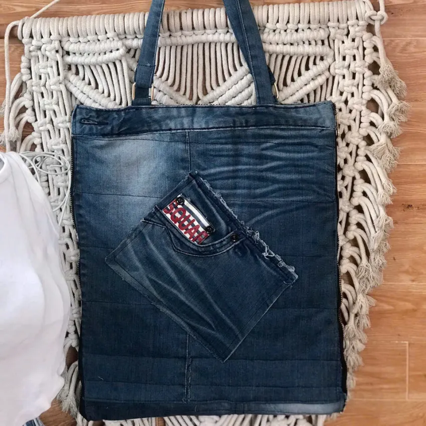 "7Color" slim tote bag from old jeans honors creative souls through unique denim craftsmanship, offering a fashionable accessory that makes an impressive and meaningful handmade birthday gift. "7Color" slim tote bag from old jeans honors creative souls through unique denim craftsmanship, offering a fashionable accessory that makes an impressive and meaningful handmade birthday gift.