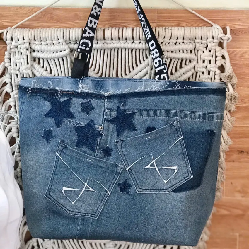 Space tote bag from old jeans captures the vibrant imprint of modern fashion through sustainable recycled denim, creating a unique fashion accessory that makes an impressive handmade birthday gift. Space tote bag from old jeans captures the vibrant imprint of modern fashion through sustainable recycled denim, creating a unique fashion accessory that makes an impressive handmade birthday gift.