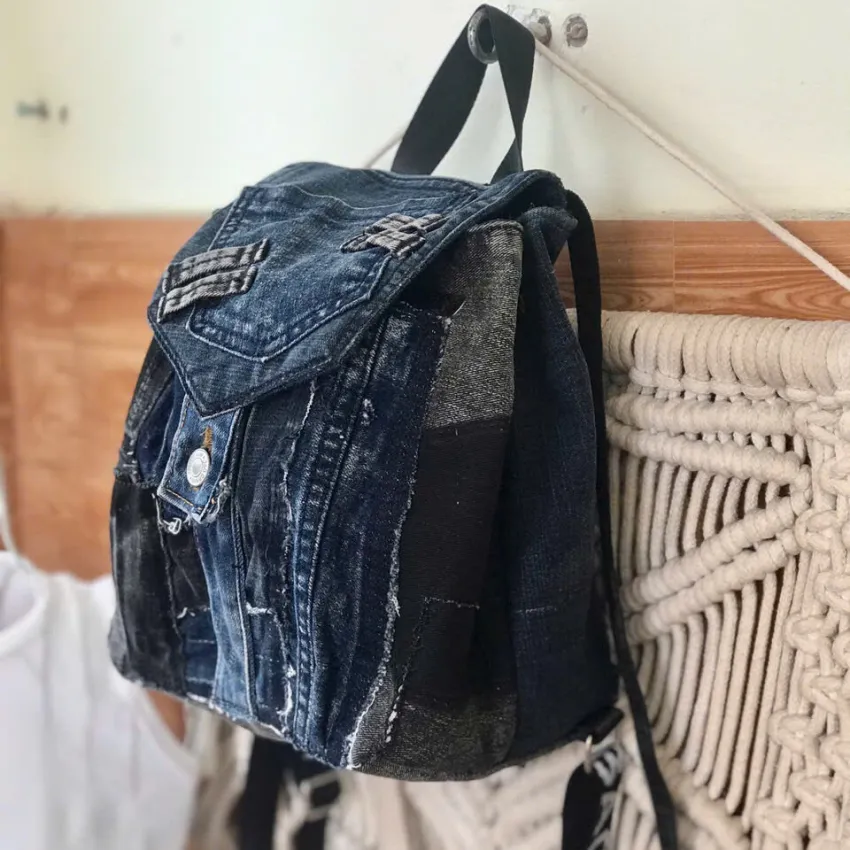 Rugged style mini backpack crafted from old jeans creates street fashion eye-catching impact with convenient drawstring design, serving as sustainable fashion accessory and creative birthday gift Rugged style mini backpack crafted from old jeans creates street fashion eye-catching impact with convenient drawstring design, serving as sustainable fashion accessory and creative birthday gift