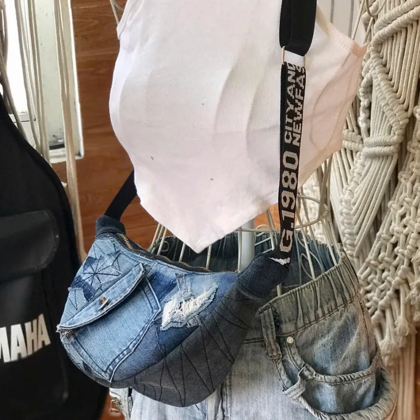 Half-moon crossbody bag with flap from old jeans balancing convenience and uniqueness, creating an upcycled denim crossbody bag and creative birthday gift for eco-fashion lovers Half-moon crossbody bag with flap from old jeans balancing convenience and uniqueness, creating an upcycled denim crossbody bag and creative birthday gift for eco-fashion lovers