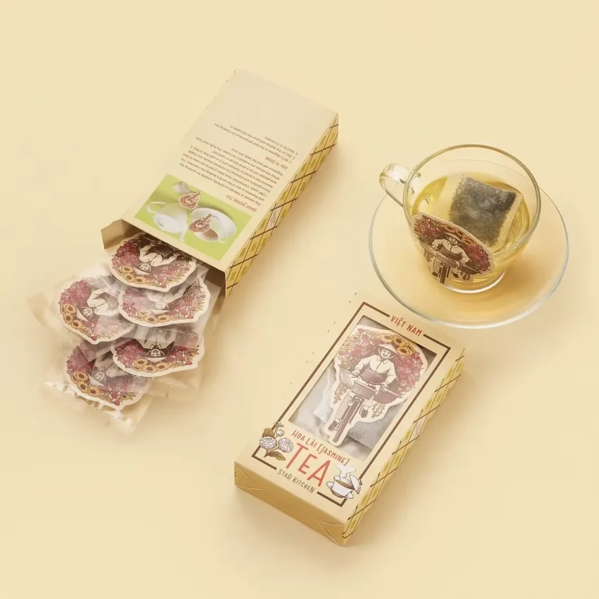 Vietnam Flower Tea combines green tea with blooming flowers in a beautifully packaged set, making it a unique souvenir and convenient specialty gift from Vietnam.